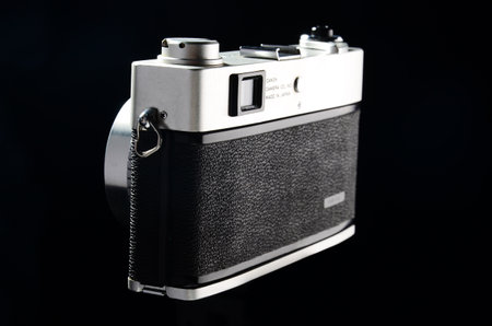 Vintage film camera on black background. Close-up view.Canon Canonet QL series, 1980, film camera, with canon fix lens 45mm f 1.7のeditorial素材