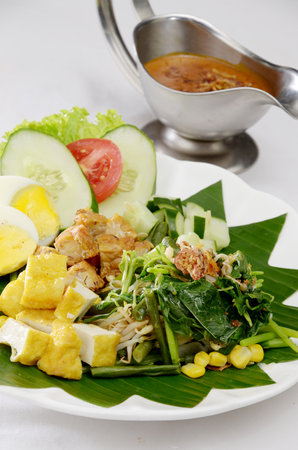 Indonesian food, Gado-gado, vegetable , tofu, tempeh, egg, serve with garnish, and spicy peanuts sauceの写真素材