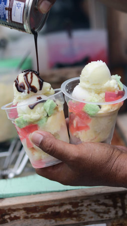 Es doger is an Indonesian coconut milk-based shaved ice beverage with pinkish color often served as...