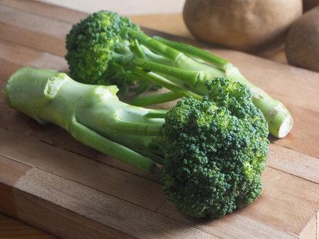 Broccoli on wooden background. Healthy food. Vegetarian concept.