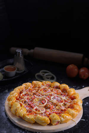 Ponorogo, East Java, Indonesia on March 22, 2021. Pizza type food. introduce its sales products. Sellers create catalogs by documenting them to attract buyers' attention.の写真素材