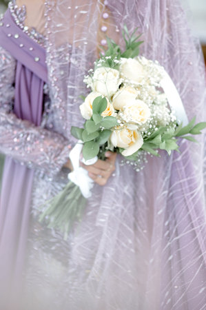 Bride holding wedding bouquet in her hands. Close-up.の写真素材