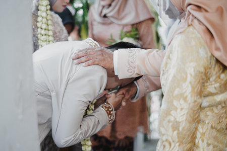 Bride and groom hug each other with love and tenderness during wedding ceremonyの写真素材