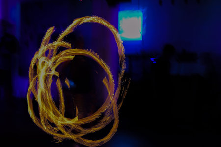 MAN DANCING AND ABSTRACT FIGURES MADE WITH FIRE