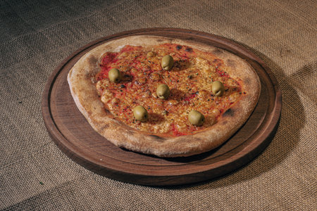 Home made cheese italian Pizza with tomate sauce and black backgroundの写真素材