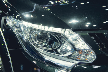 Headlight of a modern luxury car, auto detail,car care concept ,daytime running light
