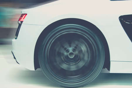 Sport car running at high speed on roadの写真素材