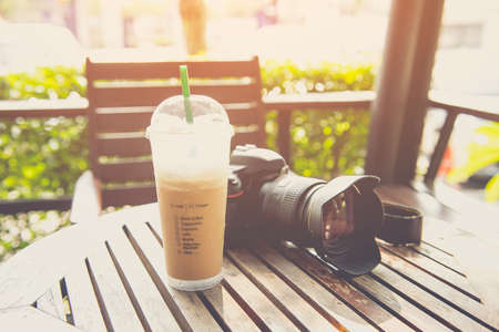 Cold iced coffee on wooden table in the coffee shopの写真素材