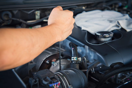 Hand of auto mechanic with a wrench. Car repair close up
