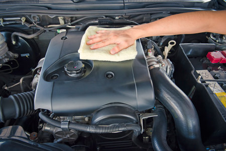 A man checking the auto engine,  uses a wrench to fix the car engine,repair serviceの写真素材