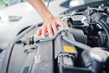 A man checking the auto engine,  uses a wrench to fix the car engine,repair service.