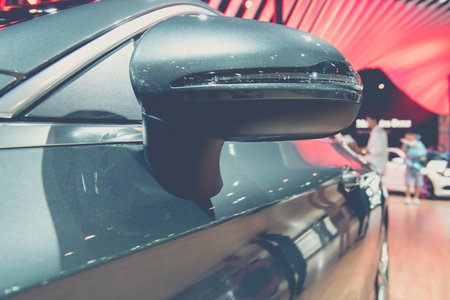 Close-up of the rear view mirror of a modern car.