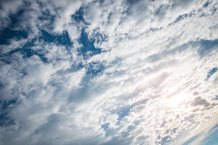 Blue sky background with tiny cloudsの写真素材