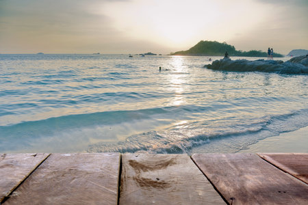 Wooden pier on the beach at sunset in Phuket, Thailand