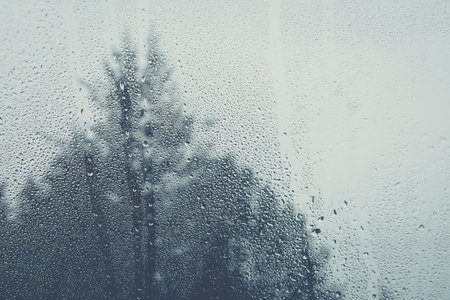 Drop of water on glass, out of focusの写真素材