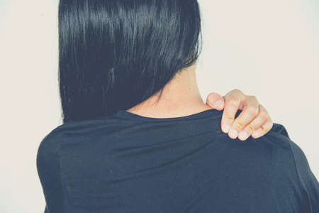Young woman sore throat paind on white backgroundの写真素材