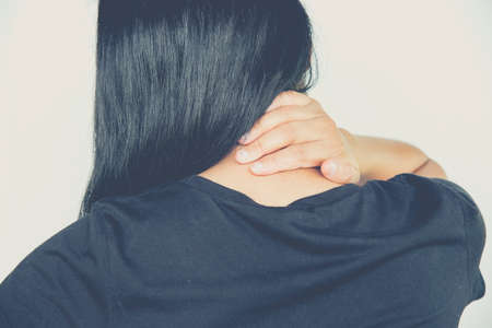 Young woman sore throat paind on white backgroundの写真素材