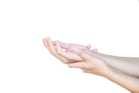 A young man' hand is displaying a thumbs upの写真素材