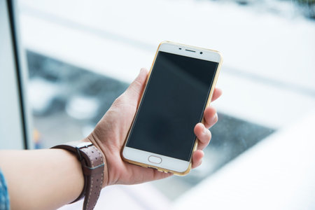 Woman sending message on smartphone ,touching smartphone screenの写真素材