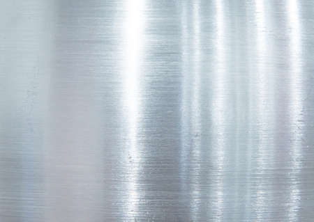 Grey grunge metal textured wall backgroundの写真素材