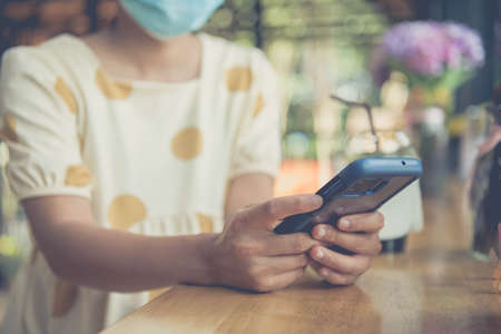 Woman use smartphone choosing social media interactions on mobile phone, concept, internet digital marketingの写真素材