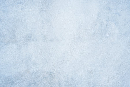 Decorative light blue painted wall background. Beautiful abstract stucco texture,wall decor for design.の写真素材