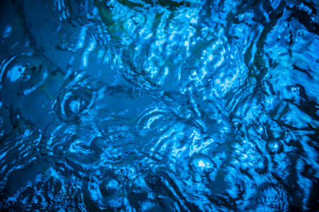 Water waves with shining texture background.の写真素材