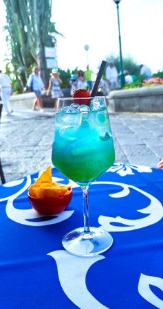 Cocktails on a blue tablecloth in a summer cafe.の写真素材