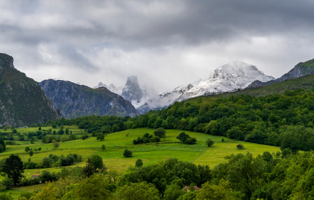 Panoramic view from Mirador del Pozo la OraciÃ³n featuring majestic Naranjo de Bulnes Peak.の写真素材