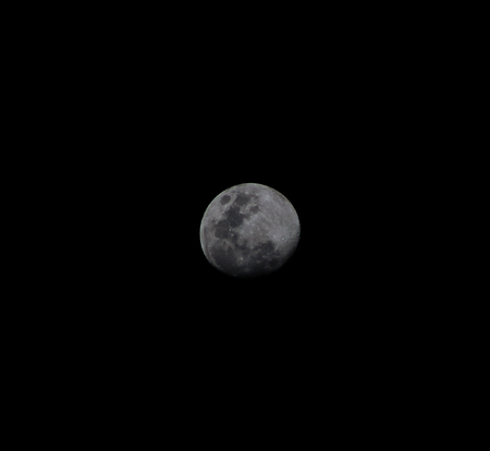 crescent moon illuminating the darkness of the skyの写真素材