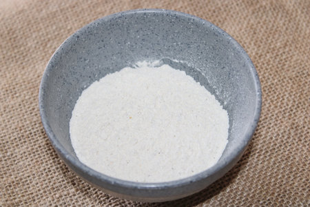 White Flour in a Rustic Ceramic Bowlの写真素材