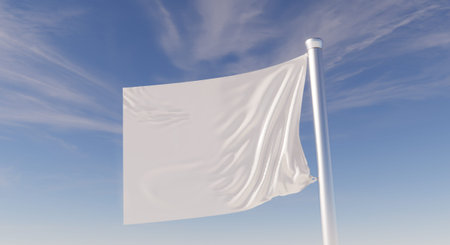 Blank White Flag on a Flagpole Against a Blue Sky