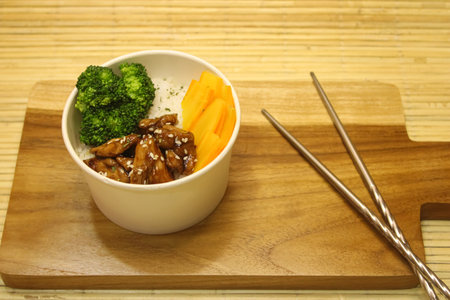 Teriyaki Chicken Rice Bowl with Fresh Broccoliの写真素材