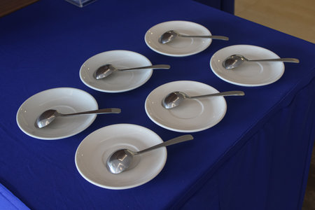 Plates and spoons are arranged on the table.の写真素材