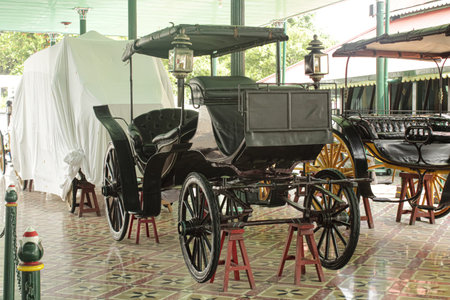 Vintage Royal Carriages Displayed in Traditional Museum Setting