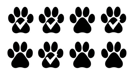 Paw Print with Check Mark Approval Silhouette Icon isolated on plain white background.のイラスト素材