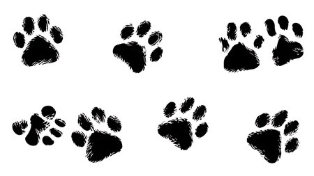 Seamless Animal Paw Print Pattern Silhouette Set isolated on plain white background.のイラスト素材