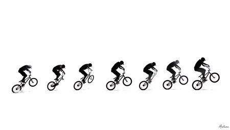 BMX Nose Manual Front Wheel Balance Silhouettes isolated on plain white background.