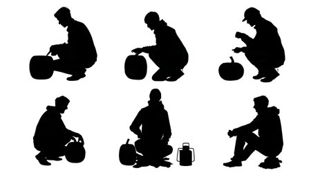 Autumn Camper Carving Pumpkin Silhouettes Set isolated on plain white background.のイラスト素材