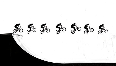 BMX Alley-Oop Half-Pipe Maneuver Silhouettes isolated on plain white background.のイラスト素材