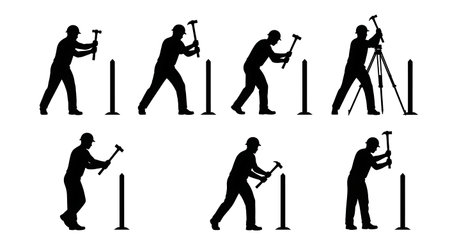 Black Solid Surveyor Hammering Stakes Silhouettes Set of Six on White Background isolated on plain white background.のイラスト素材