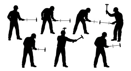 Black Solid Worker Pulling Nail Silhouettes Set of Six on White Background isolated on plain white background.のイラスト素材
