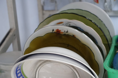 Stack of clean dishes in the kitchen. Close-up. Selective focus.の写真素材