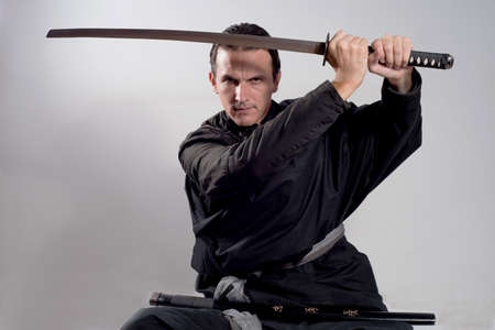 samurai holdin katana over his headの写真素材