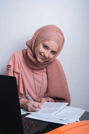 Muslim woman working in officeの写真素材