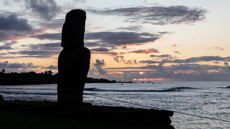 A moai at sunset on the coast of Hanga Roa on Rapa Nui.の写真素材