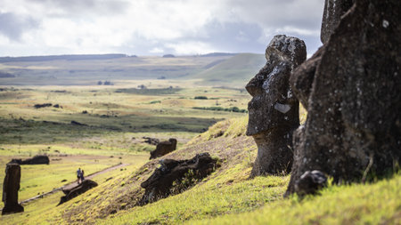 Fallen moais on the slopes of Rano Raraku, the cradle of the stone people on Rapa Nui, Easter Island.の写真素材