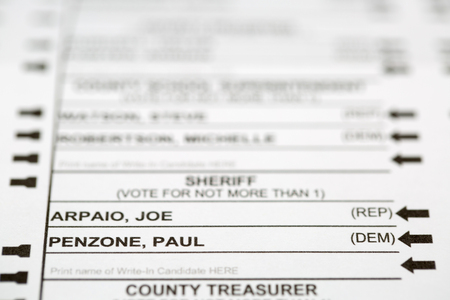 PHOENIX, AZ - OCTOBER 21, 2016: Selective focus on the Joe Arpaio and Paul Penzone Sherrif options listed on the 2016 Maricopa County, Arizona, United States general election early voting ballot with room for text in blurred areasのeditorial素材