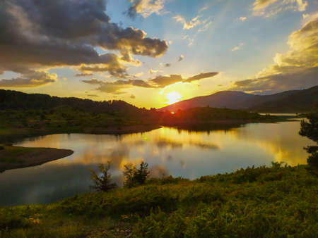 Sunset over the lake in Greece eastern europeの写真素材