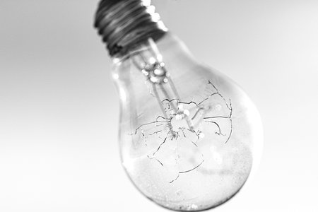 bulb with a bullet hole, it is cracked